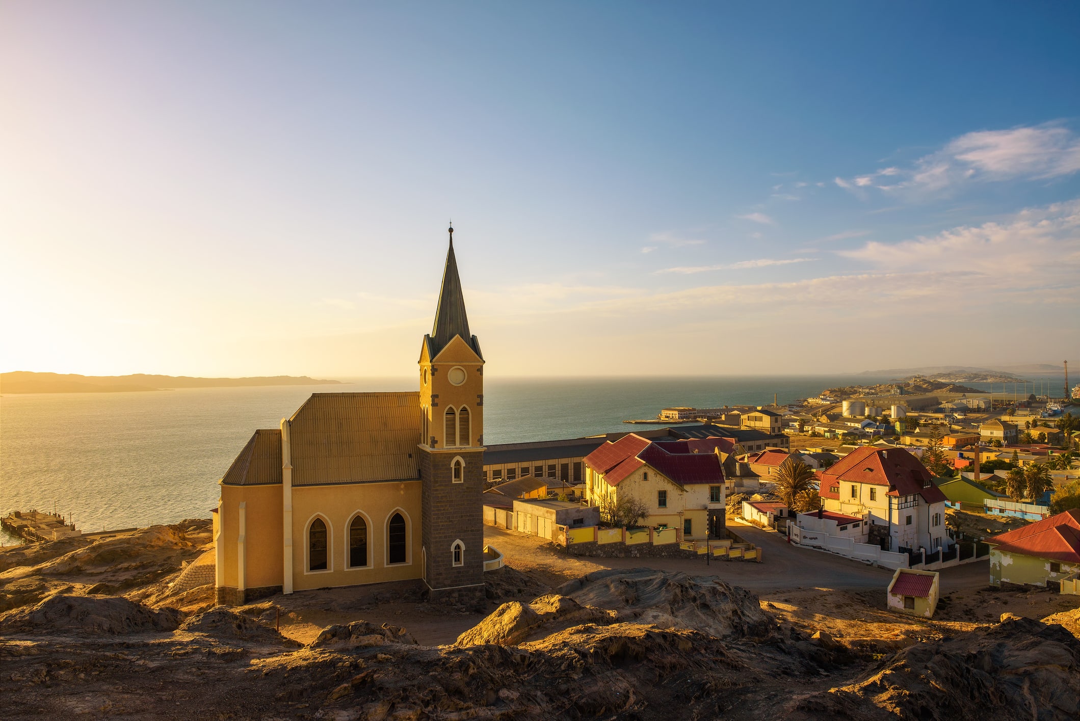 luderitz in namibia with lutheran church called felsenkirche at sunset